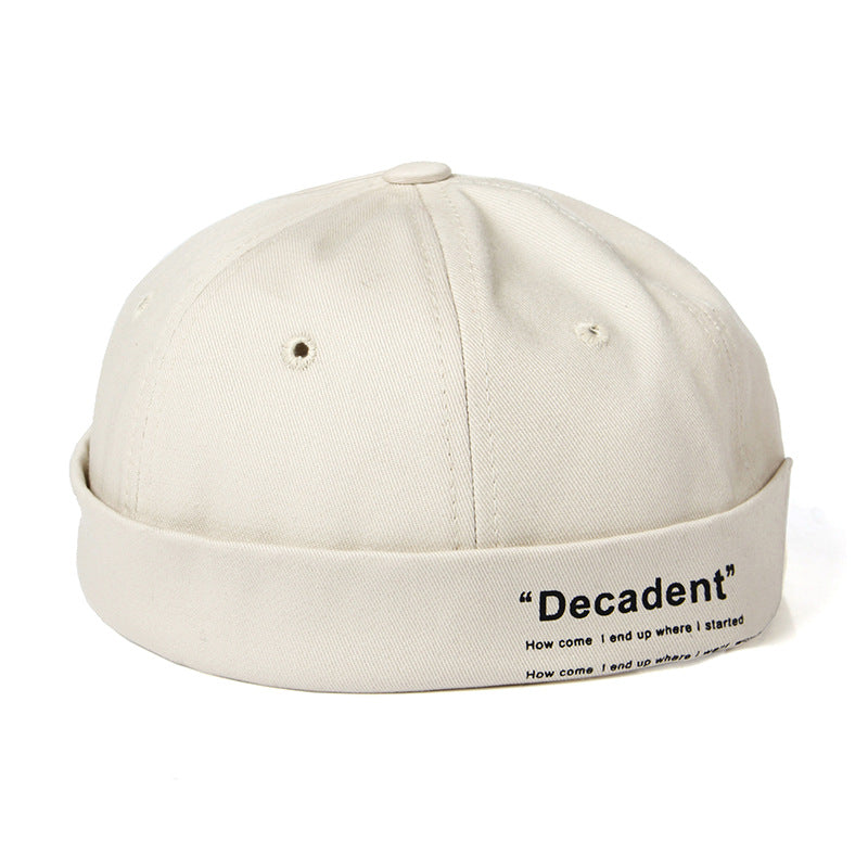 "Sleek Dome Rimless Melon Leather Hat: Contemporary Elegance for Every Occasion